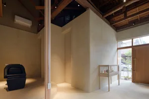 Minimalist shop interior with concrete and wooden materials.