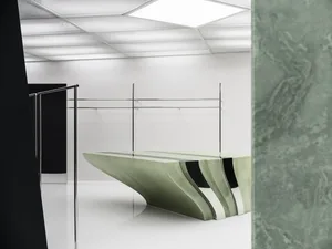 A modern interior space featuring concrete furniture and minimalist design elements.