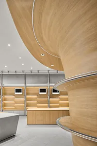A modern retail space featuring wooden elements and sleek design