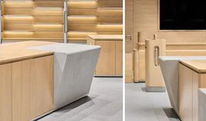 A minimalist commercial interior featuring wood and concrete elements.