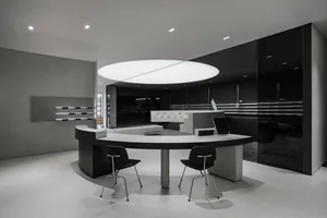 Minimalist retail store featuring concrete and glass materials.