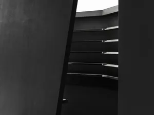 Modern black staircase with metallic elements.