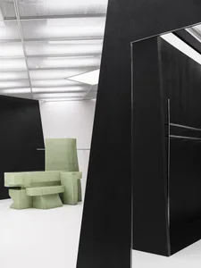 Modern interior design featuring geometric concrete furniture.
