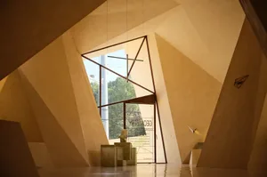 A modern interior featuring geometric shapes and concrete walls.