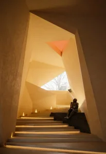The image showcases a modern interior design featuring concrete elements.
