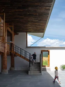 Concrete staircase with wooden railing and modern interior design elements