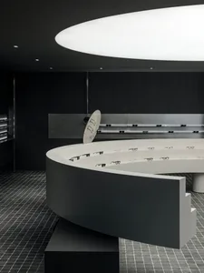 Modern retail display featuring concrete elements with glasses showcased.