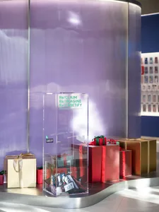 A minimalist retail store featuring metallic gift boxes