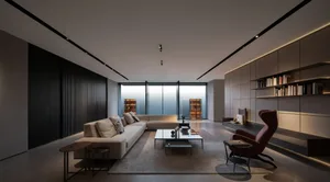 A modern living room with minimalist furniture, warm lighting, and a sleek, contemporary design.