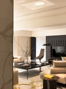 Modern living room featuring marble accents and leather furnishings