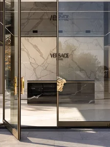 Modern retail storefront featuring marble materials and contemporary design elements.