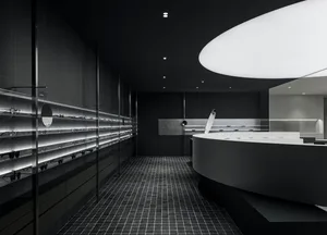 A modern retail storefront with polished concrete surfaces and a minimalist interior design.