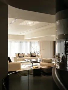 Modern white leather living room with minimalist design elements.