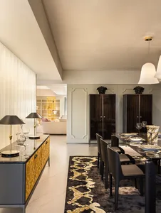 Luxurious dining room featuring metallic furniture and leather accents