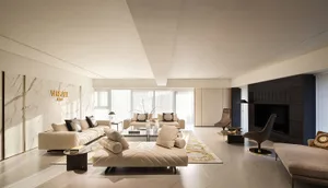 A luxurious living room with modern marble finishes and leather furniture.
