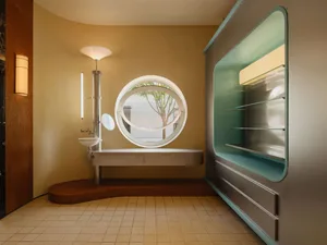 Modern bathroom featuring metallic finishes, glass, and wooden elements.