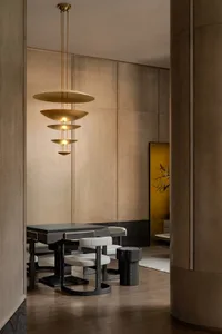 Modern dining room with wooden furniture and minimalist design.