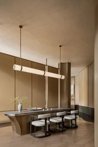 A modern living room featuring wooden furniture and light-colored walls.