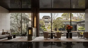 Modern lobby features glass and marble elements for sophisticated design.