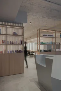 A modern minimalist salon interior with sleek furniture and a minimalist design aesthetic.