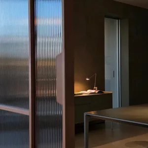 Modern interior design features a sleek glass window with minimalist styling.
