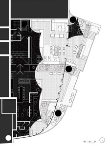 A detailed architectural floor plan of a commercial space, showing various functional zones and layouts.