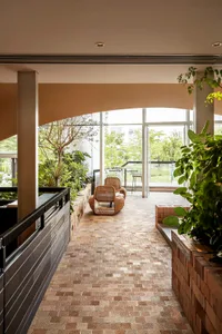 Modern interior space with timber, concrete, and brick materials