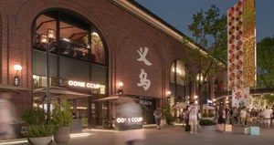 Retail storefront with large glass windows, marbled interior, and brick facade.