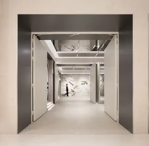 An image of a minimalist office interior with concrete and metal materials.