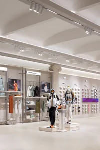 A retail store interior featuring modern design elements with concrete as the primary material.