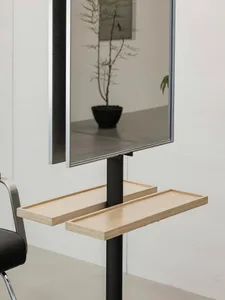 A modern floating desk with a white oak top and black base, featuring metal shelves with wood accents and a sleek, minimalist