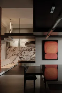 Modern dining room featuring a marble bar and minimalist design elements.