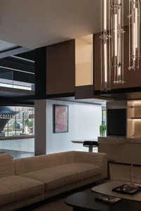 Modern living room with wooden furniture and metallic accents