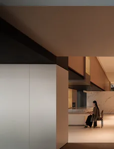 A modern residential kitchen with marble accents and concrete finishes.