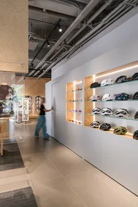 A modern retail storefront with wooden shelving and a minimalist design.