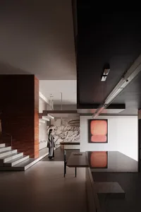 A modern kitchen featuring marble and concrete materials.