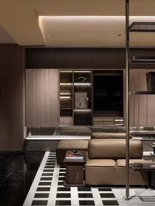 Modern lounge area featuring contemporary leather sofas and polished marble flooring