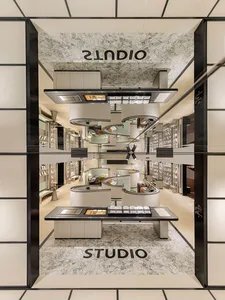 Modern retail storefront with marble and glass materials and a minimalist design.