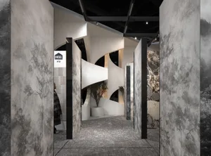 Modern interior exhibition space with concrete and marble materials.