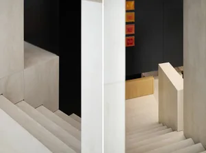 Concrete stairs with a modern aesthetic, accompanied by wooden cabinets.