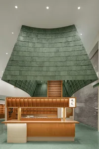 Industrial commercial interior with steel elements, green accents, and functional design.