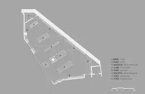 A modern office space with wooden floors, desks, and cabinets.