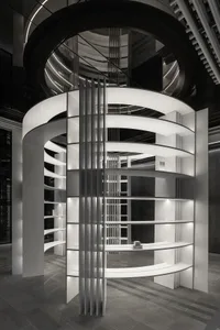 A minimalist interior design featuring a white lighting structure.