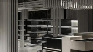 A modern interior design featuring black metal elements and minimalist decor.