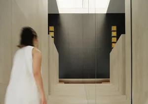 A modern interior space with concrete walls and flooring.