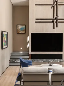 A minimalist living room featuring stone and wood elements