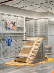 Modern, minimalist store interior featuring a metal rack system.