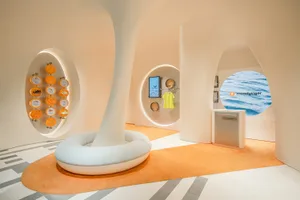 A modern retail store with a white circular structure in the center.