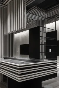 A modern shopping center counter made of metal and glass.