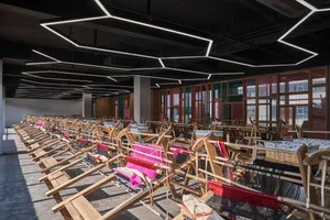 Rows of weaving looms in an industrial interior setting